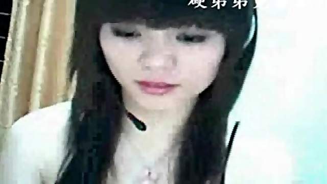 Adorable Asian teases her tits on webcam