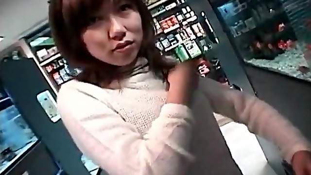 Asian sweater girl sucks dick in back room of store