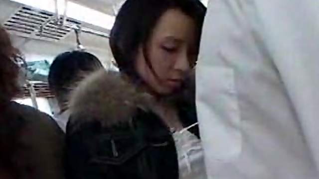 Japanese girl giving HJ on crowded train