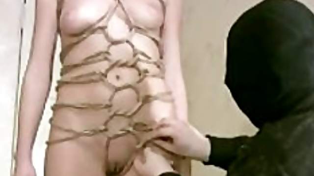 Sexy girl put in impressive rope bondage